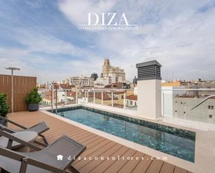 Exterior view of Duplex for sale in  Madrid Capital  with Air Conditioner, Terrace and Swimming Pool