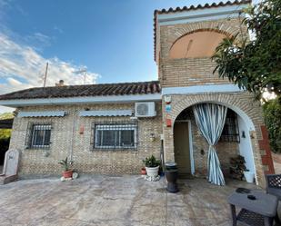 Exterior view of House or chalet for sale in La Puebla del Río  with Air Conditioner, Private garden and Terrace