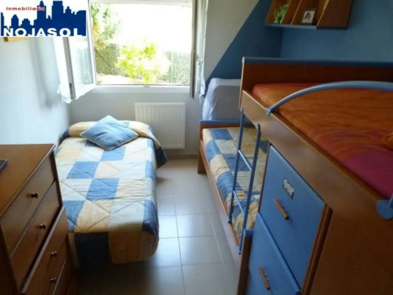 Dormitori de Apartament de lloguer en Arnuero amb Calefacció, Jardí privat i Terrassa