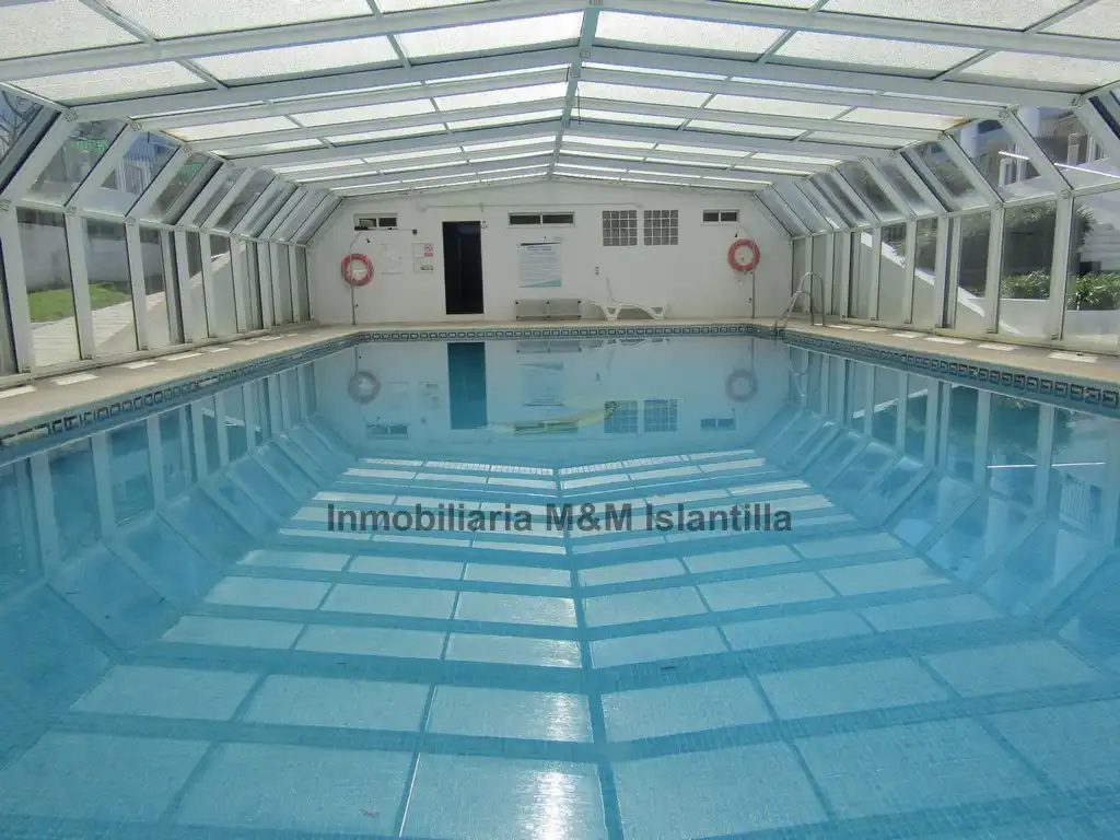 Piscina de Casa adosada en venta en Islantilla con Terraza, Trastero y Amueblado