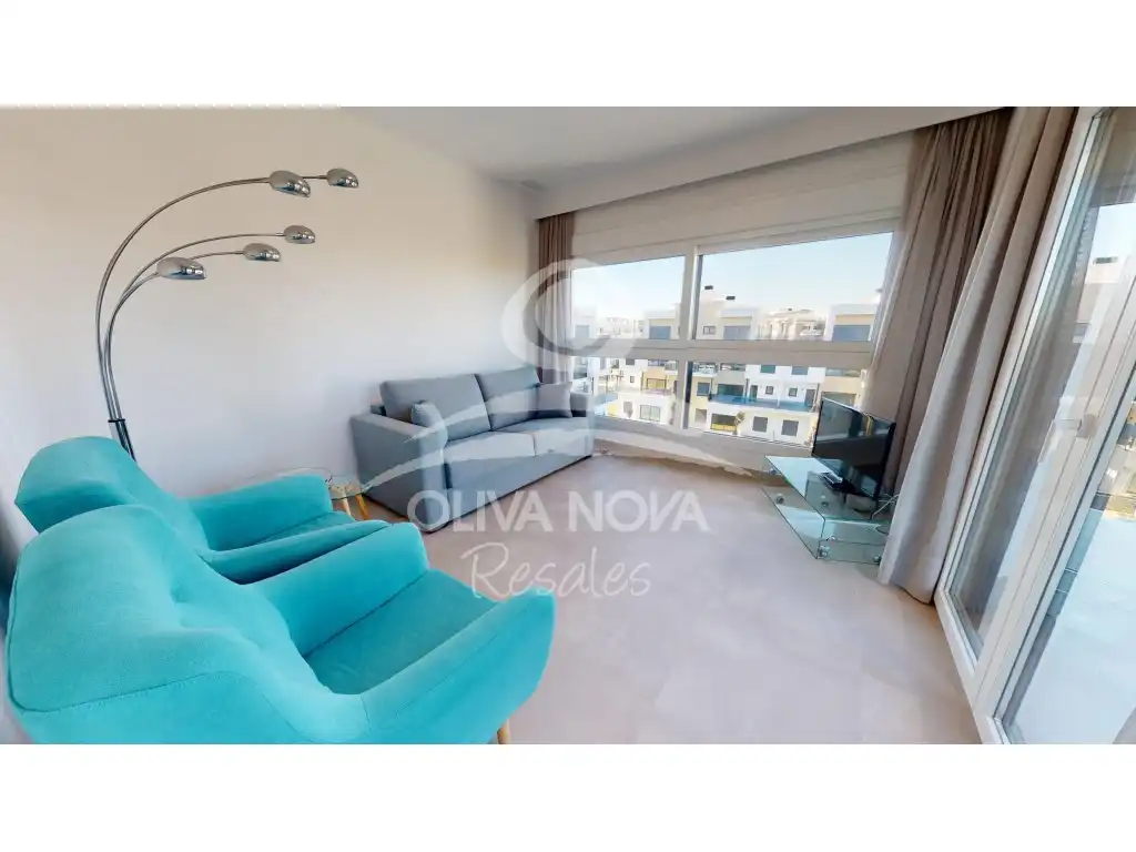 Sala d'estar de Apartament en venda en Oliva amb Aire condicionat, Jardí privat i Terrassa