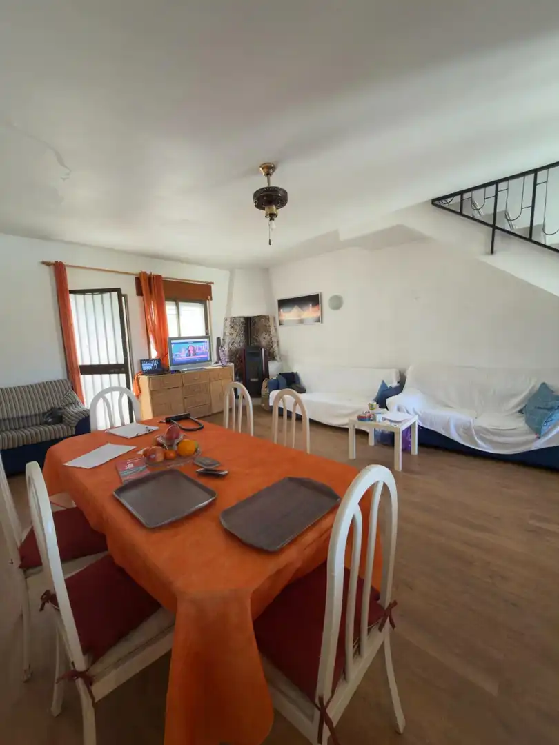 Sala d'estar de Casa adosada en venda en Benalmádena amb Aire condicionat, Terrassa i Moblat