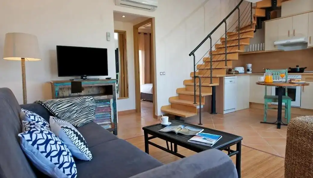 Sala d'estar de Casa adosada en venda en La Oliva amb Aire condicionat, Jardí privat i Terrassa
