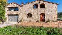 Vista exterior de Finca rústica en venda en Breda amb Aire condicionat