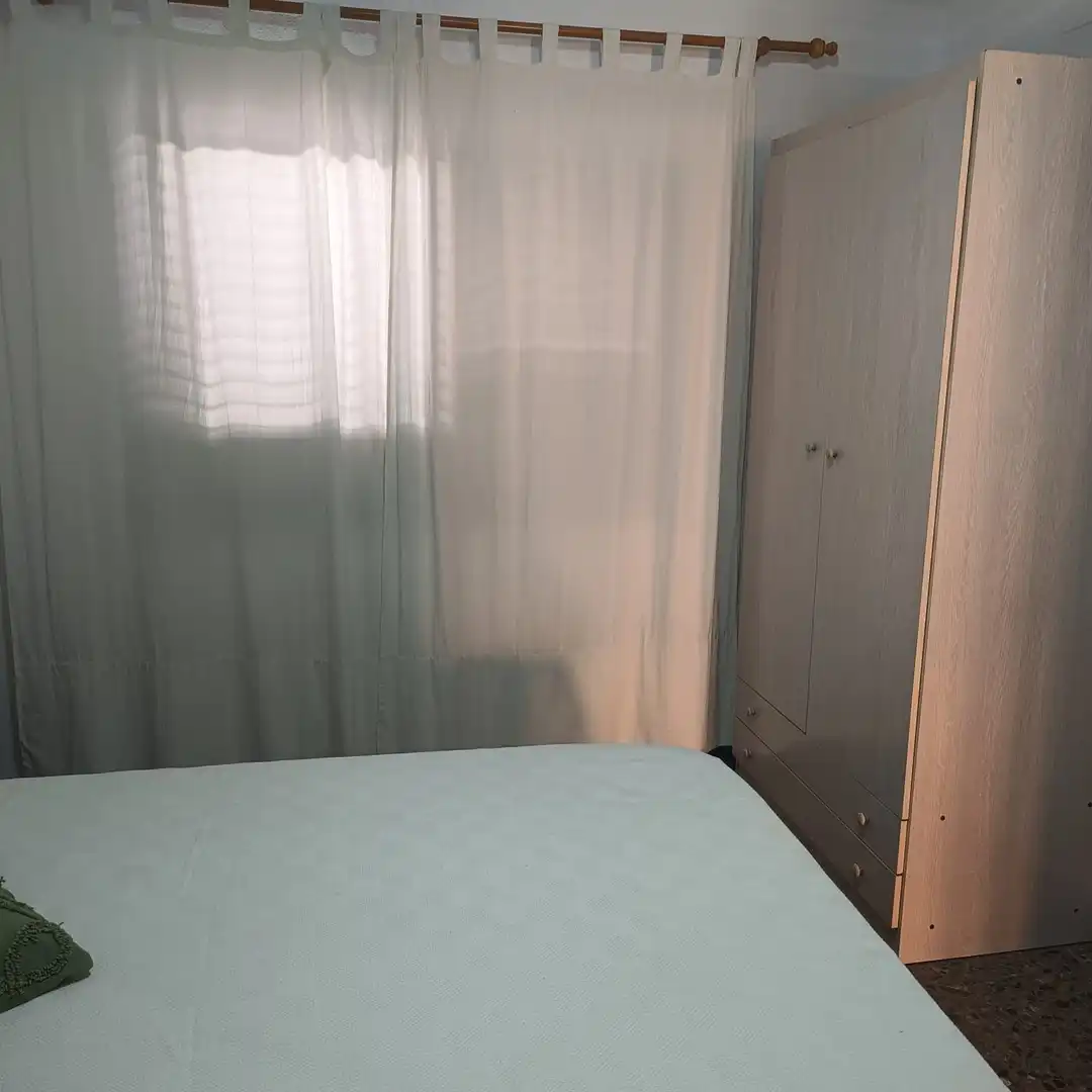 Habitación de Apartamento de alquiler en La Pobla de Farnals con Aire acondicionado, Calefacción y Jardín privado