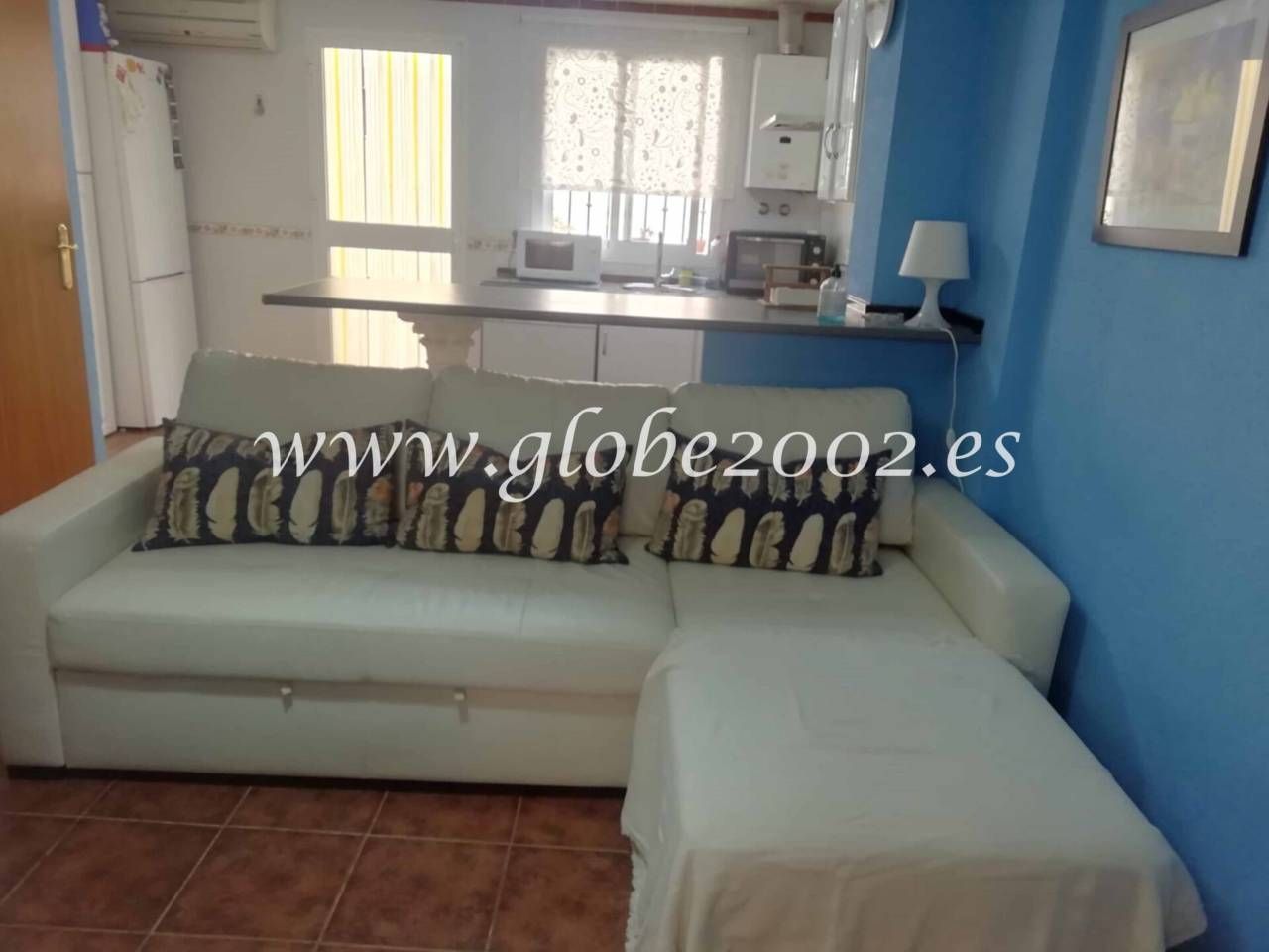 Sala d'estar de Casa adosada de lloguer en Chiclana de la Frontera amb Aire condicionat, Moblat i Piscina comunitària