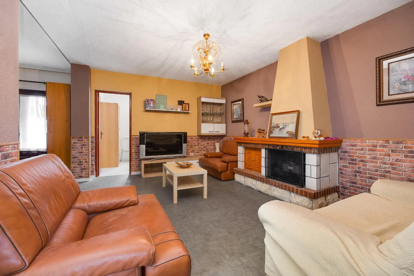 Sala d'estar de Casa adosada en venda en Orihuela amb Aire condicionat, Jardí privat i Terrassa