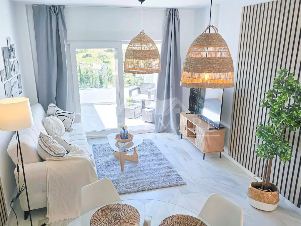 Sala de estar de Casa adosada en venta en Nerja con Aire acondicionado, Terraza y Amueblado
