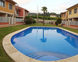 Piscina de Casa adosada en venda en Ribadumia amb Calefacció, Parquet i Terrassa