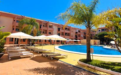 Piscina de Apartament de lloguer en Punta Umbría amb Aire condicionat, Calefacció i Jardí privat