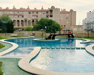 Piscina de Apartament de lloguer en El Campello amb Aire condicionat, Terrassa i Balcó