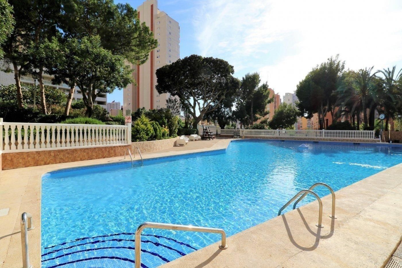 Swimming pool of Apartment for sale in Benidorm  with Air Conditioner, Private garden and Community pool