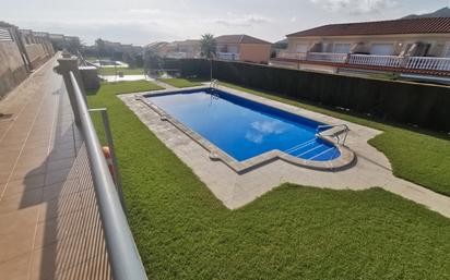 Piscina de Casa adosada en venda en Mont-roig del Camp amb Aire condicionat, Jardí privat i Piscina comunitària