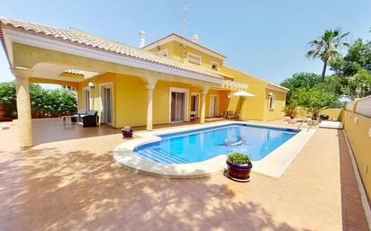 Vista exterior de Casa o xalet en venda en La Manga del Mar Menor amb Aire condicionat, Jardí privat i Terrassa