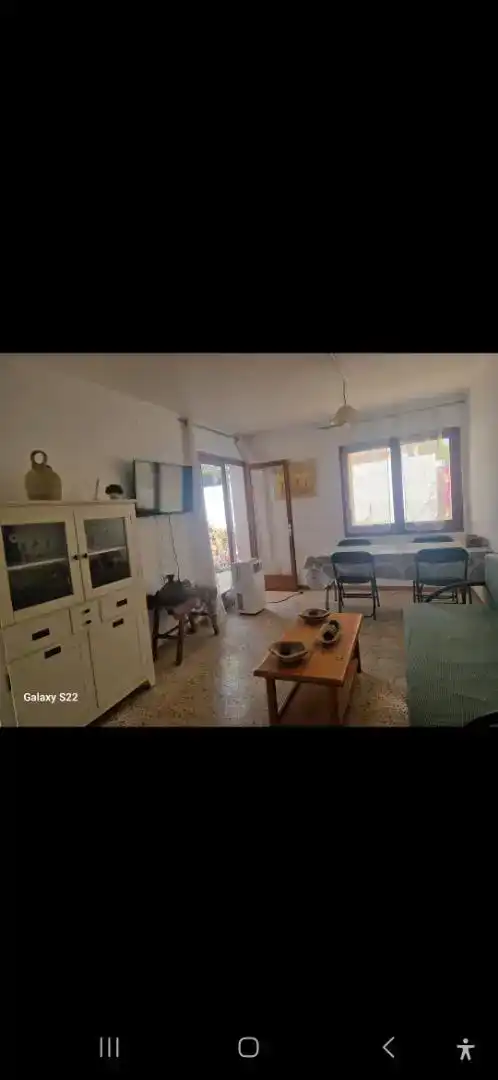 Sala d'estar de Casa adosada en venda en L'Ametlla de Mar  amb Aire condicionat, Jardí privat i Parquet