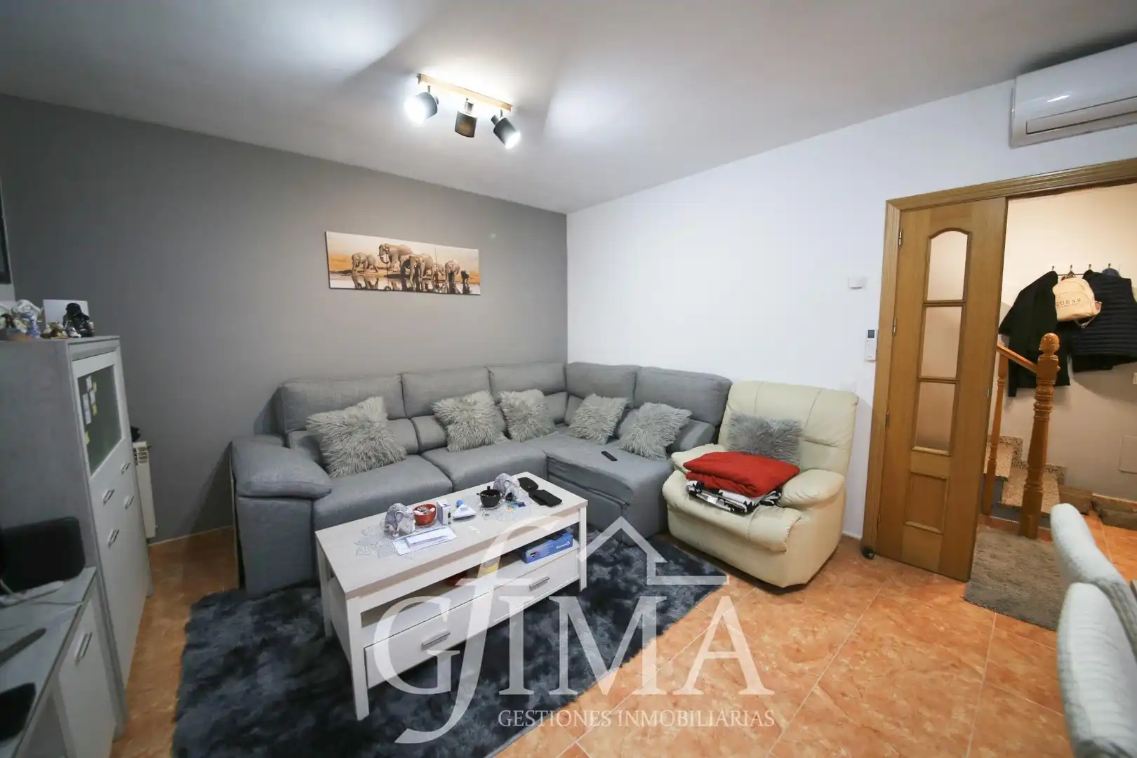 Sala de estar de Casa adosada en venta en Tomelloso con Aire acondicionado, Calefacción y Amueblado