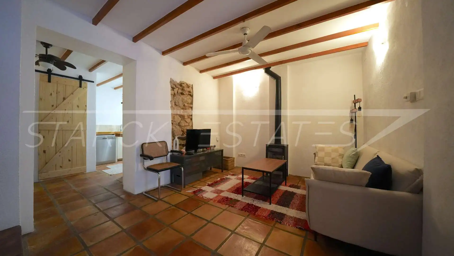 Sala de estar de Casa adosada en venta en Benidoleig