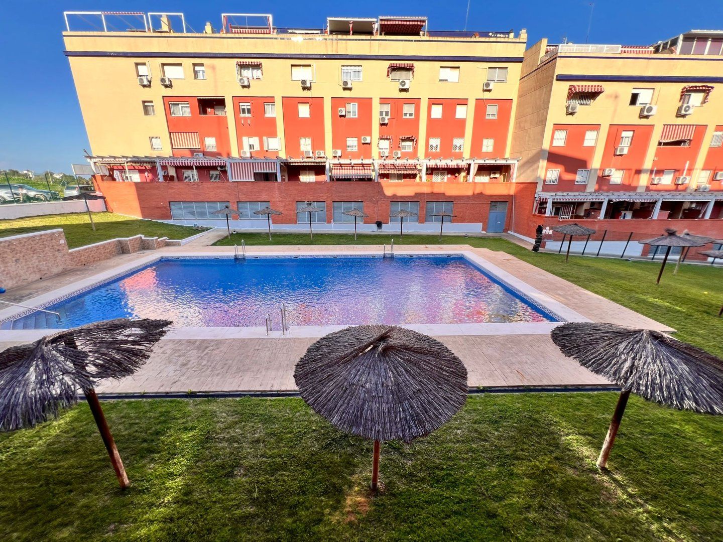 Swimming pool of Duplex for sale in San Juan de Aznalfarache  with Air Conditioner, Heating and Terrace