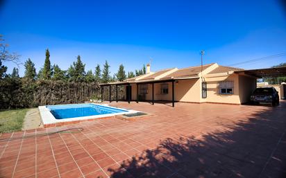 Exterior view of House or chalet for sale in Palomares del Río  with Private garden, Swimming Pool and Furnished