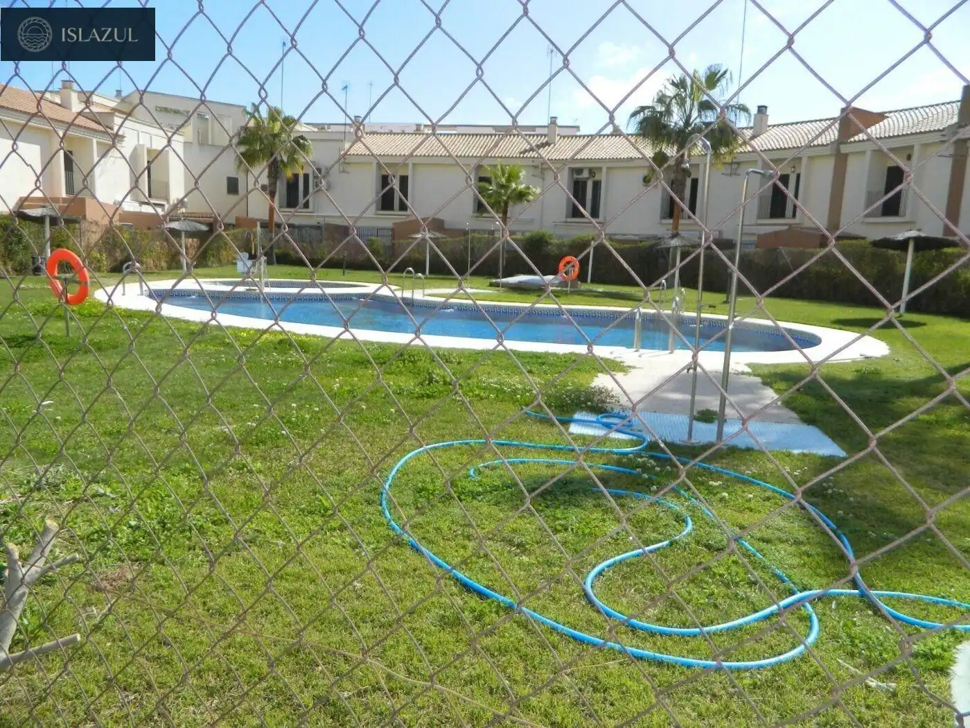 Piscina de Pis de lloguer en Isla Cristina amb Aire condicionat, Jardí privat i Terrassa