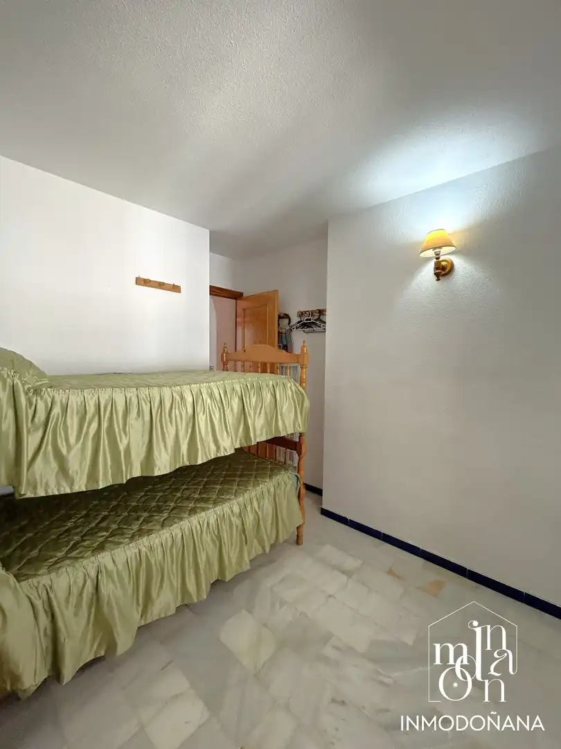Habitación de Casa adosada en venta en Almonte con Terraza, Piscina y Amueblado