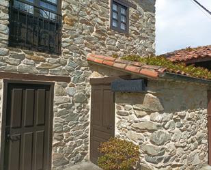 Vista exterior de Casa adosada en venda en Cudillero amb Aire condicionat, Calefacció i Jardí privat