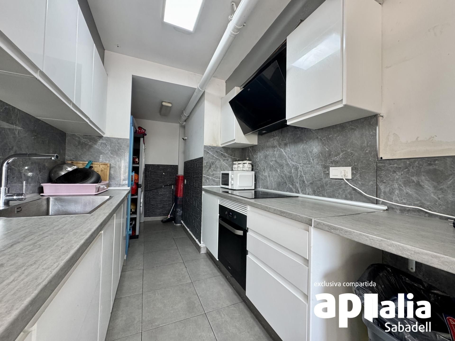 Kitchen of Flat for sale in Sabadell  with Air Conditioner, Storage room and Balcony