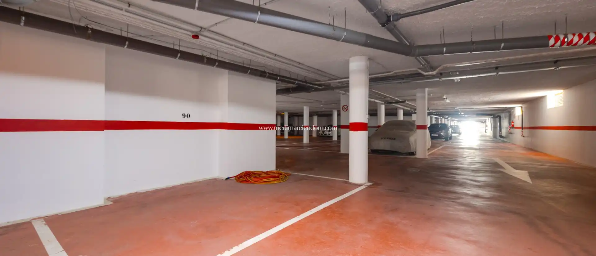 Parking of Duplexes for sale in La Manga del Mar Menor  with Air Conditioner, Heating and Private garden
