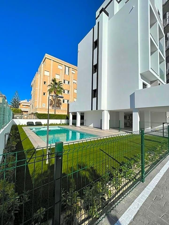 Swimming pool of Apartment for sale in Oliva  with Air Conditioner, Terrace and Community pool