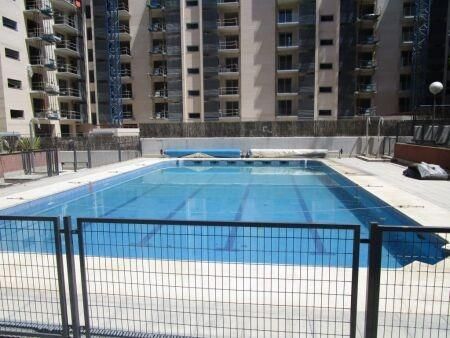 Swimming pool of Flat for sale in  Madrid Capital  with Air Conditioner, Heating and Private garden