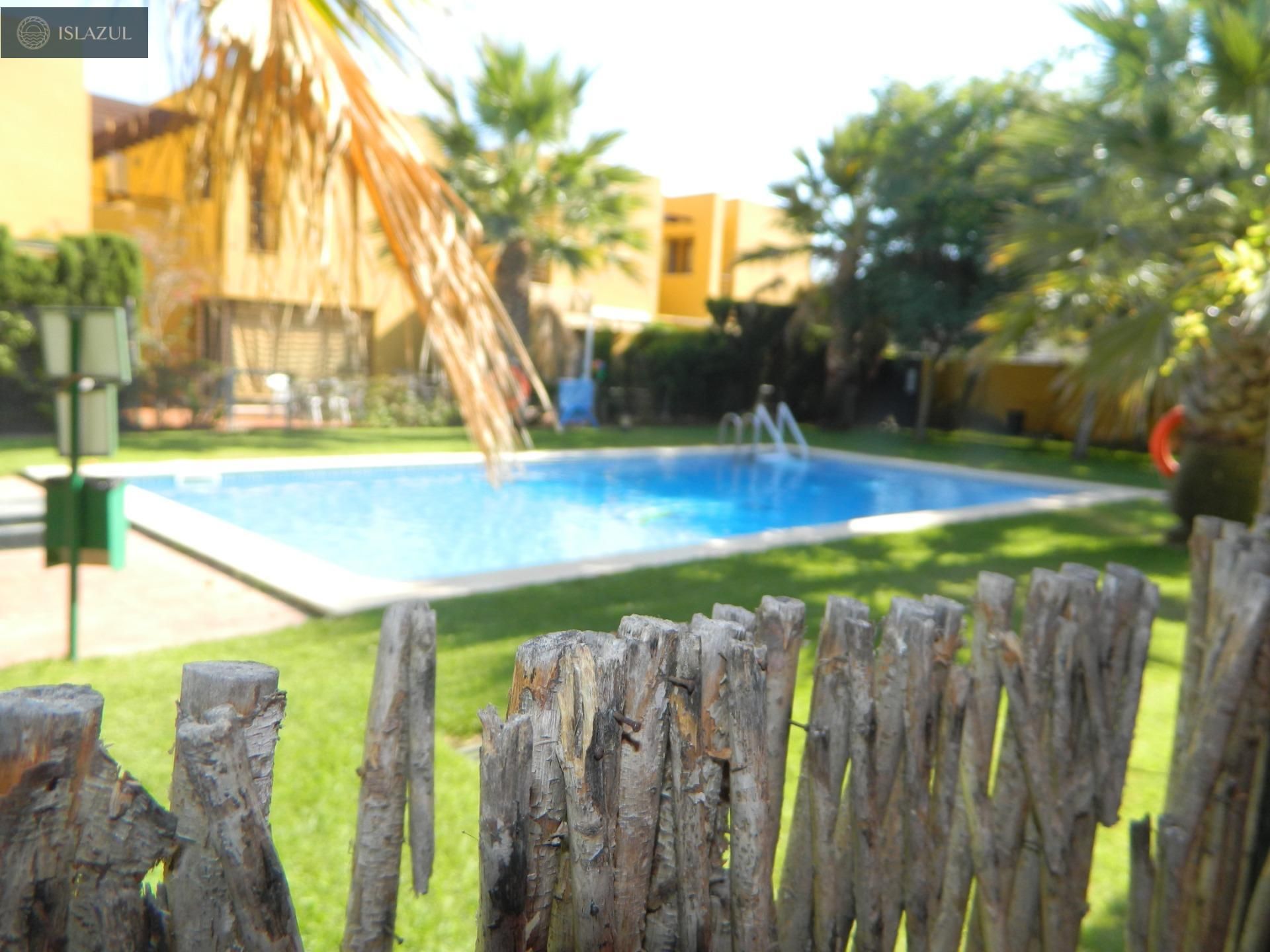 Swimming pool of Single-family semi-detached for sale in Isla Cristina  with Air Conditioner, Private garden and Terrace