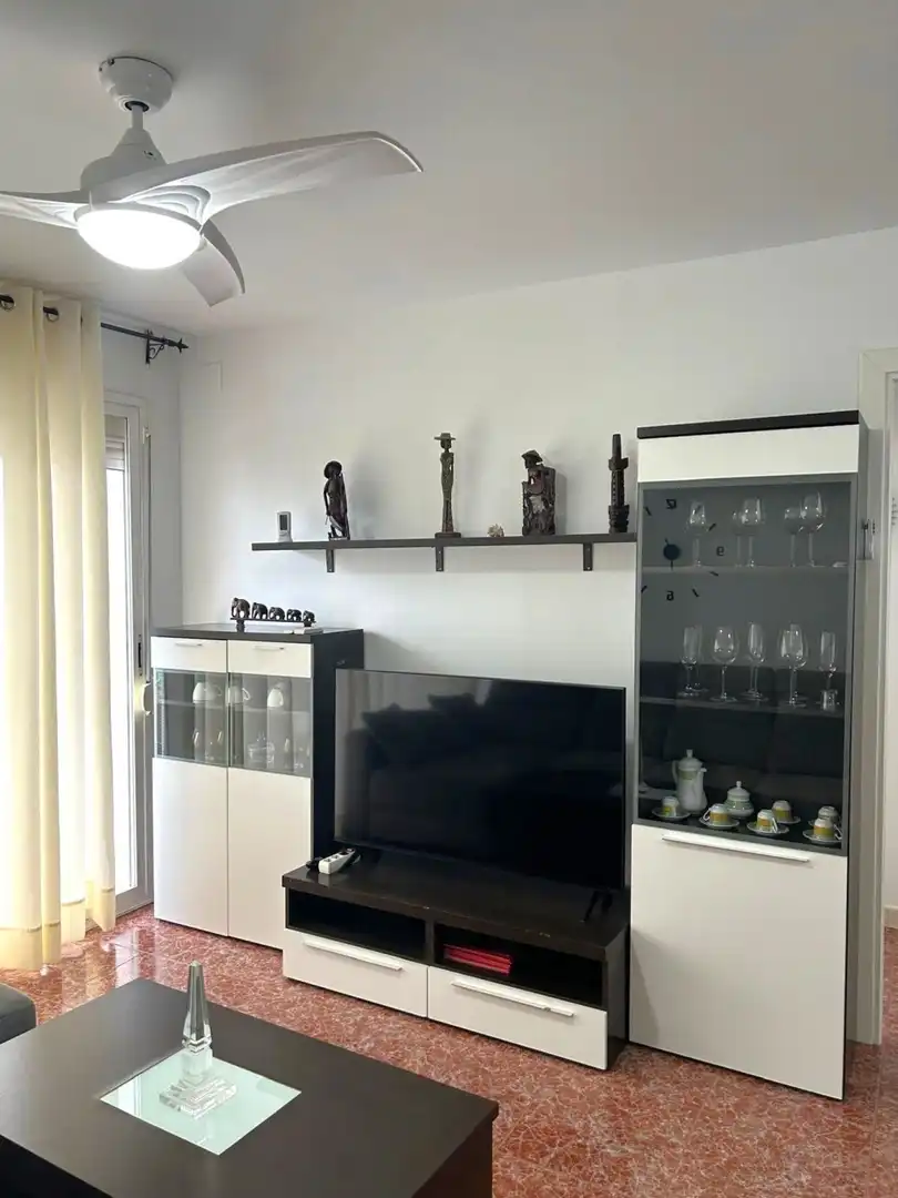 Sala d'estar de Pis de lloguer en La Pobla de Farnals amb Aire condicionat, Jardí privat i Terrassa