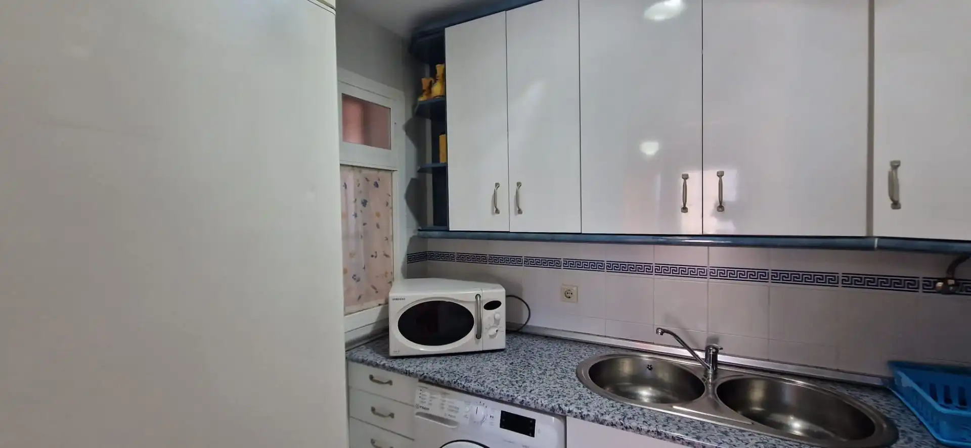 Cuina de Apartament de lloguer en El Portil amb Piscina comunitària