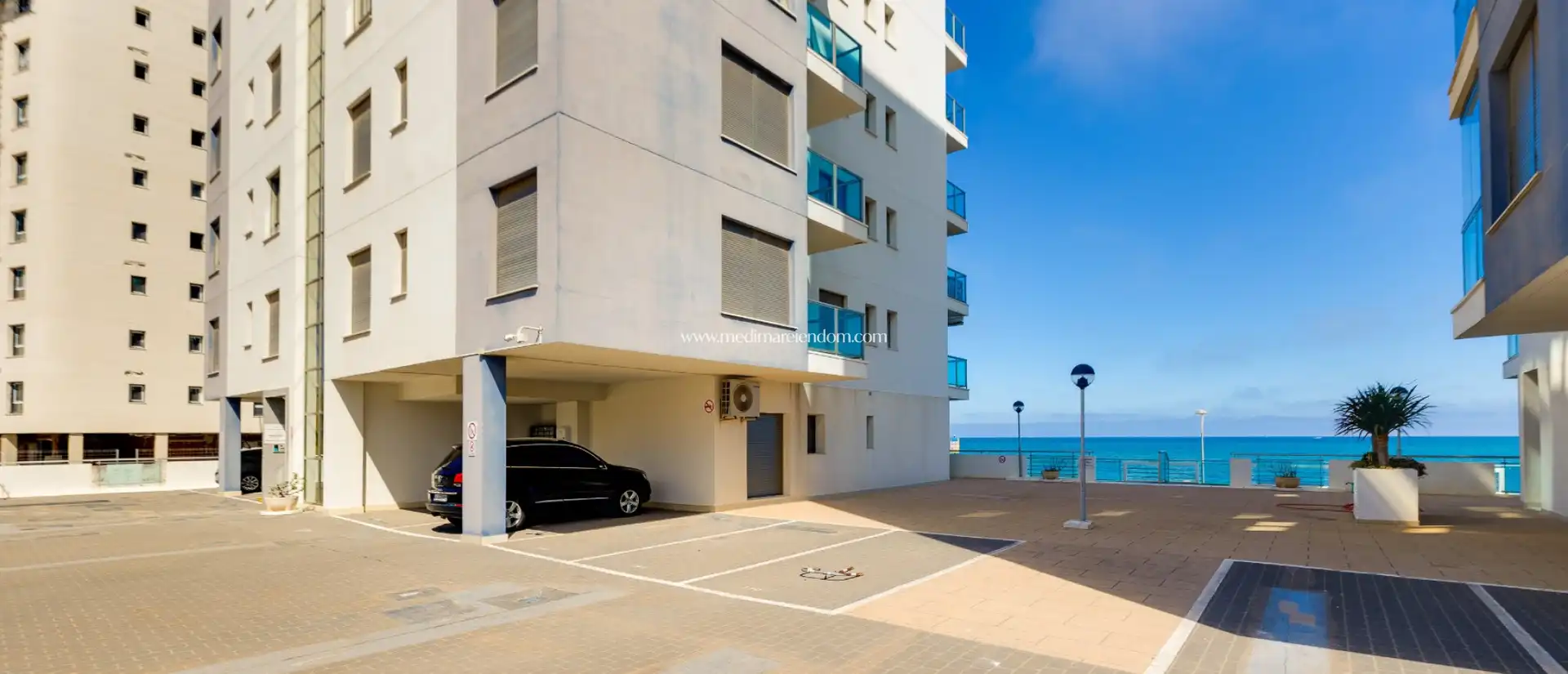 Parking of Duplexes for sale in La Manga del Mar Menor  with Air Conditioner, Heating and Private garden