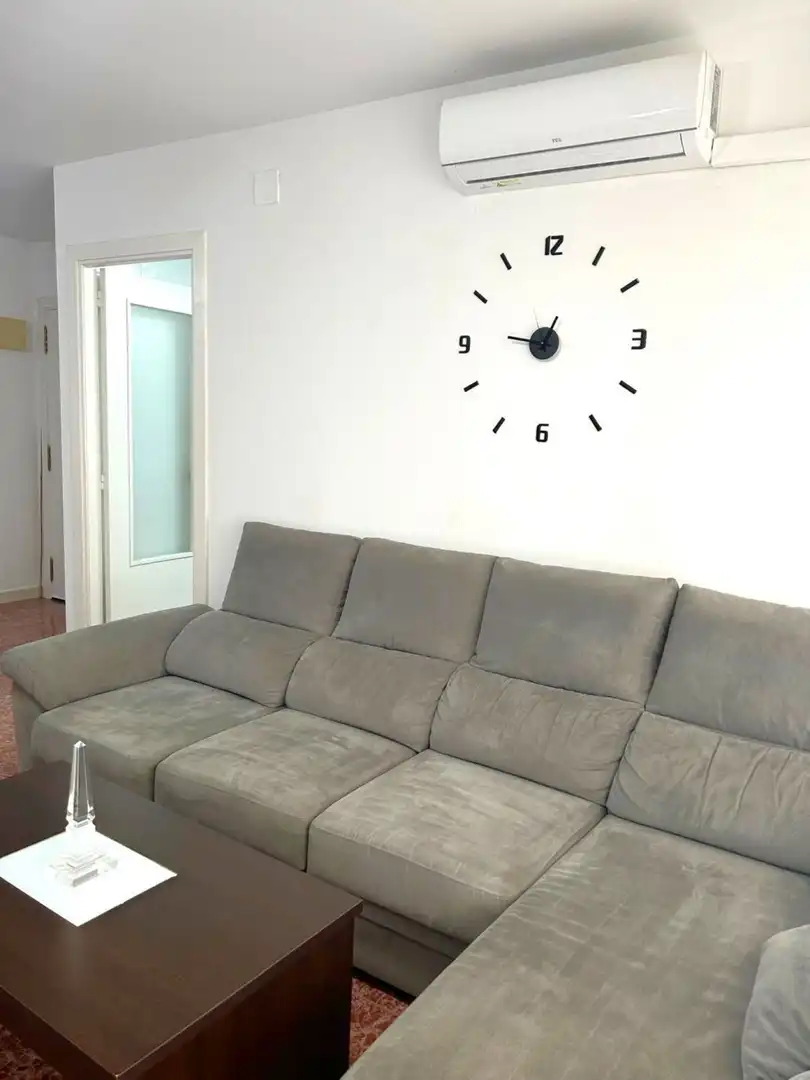 Sala d'estar de Pis de lloguer en La Pobla de Farnals amb Aire condicionat, Jardí privat i Terrassa