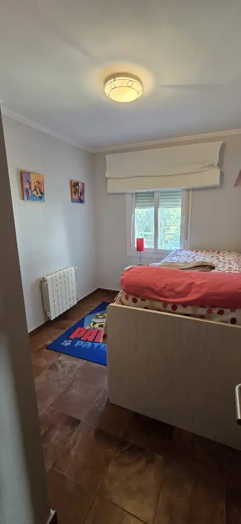 Habitación de Casa adosada en venta en El Portil con Calefacción, Trastero y Amueblado