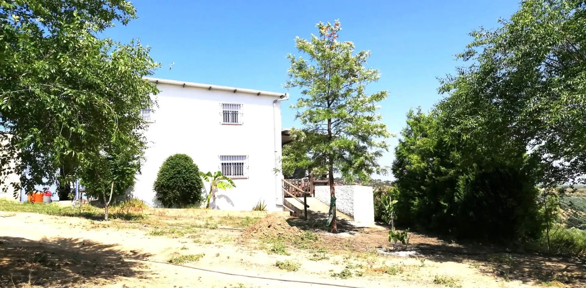 Vista exterior de Casa o xalet en venda en Villanueva del Río y Minas amb Jardí privat, Terrassa i Traster