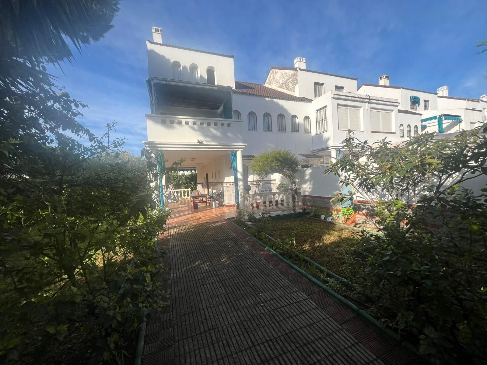 Jardí de Casa adosada en venda en El Portil amb Calefacció, Jardí privat i Terrassa