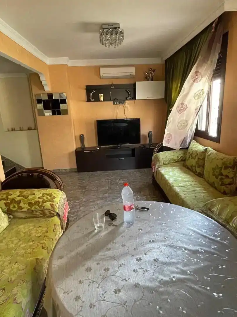 Sala d'estar de Casa adosada en venda en Melilla amb Aire condicionat, Parquet i Moblat