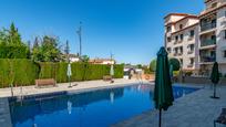 Swimming pool of Flat for sale in Ogíjares  with Air Conditioner, Heating and Storage room
