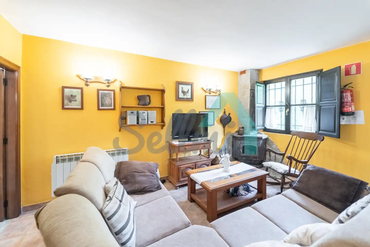 Sala de estar de Casa o chalet en venta en Quirós con Calefacción, Jardín privado y Terraza