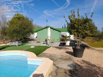 Exterior view of Country house for sale in Rociana del Condado  with Private garden, Swimming Pool and Furnished