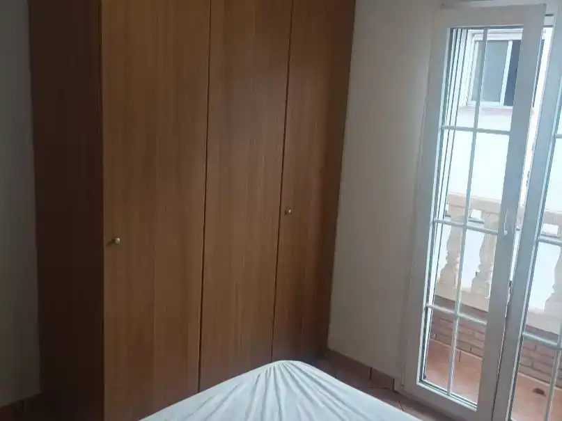 Dormitori de Casa adosada de lloguer en Vélez-Málaga amb Balcó