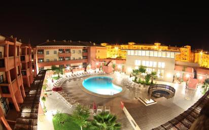 Piscina de Apartament de lloguer en Punta Umbría amb Aire condicionat, Calefacció i Jardí privat