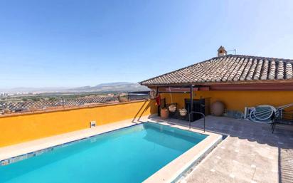 Swimming pool of Attic for sale in La Zubia  with Air Conditioner, Heating and Parquet flooring