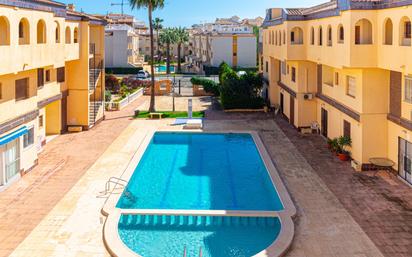 Swimming pool of Apartment for sale in Torrevieja  with Air Conditioner, Heating and Terrace