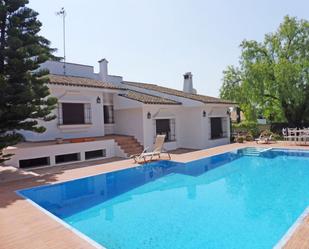 Vista exterior de Casa o xalet de lloguer en Sanlúcar la Mayor amb Aire condicionat, Jardí privat i Terrassa