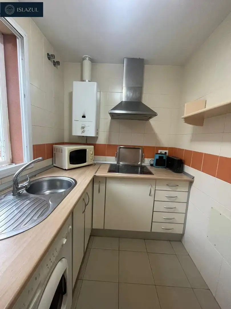 Cuina de Casa adosada en venda en Isla Cristina amb Jardí privat, Terrassa i Moblat