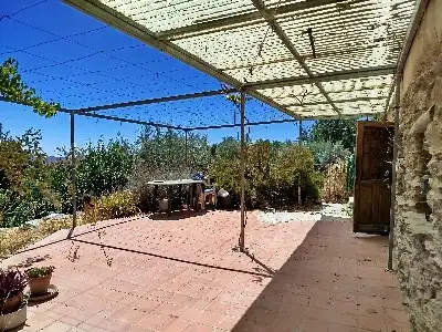 Jardí de Finca rústica en venda en Alpujarra de la Sierra amb Calefacció, Jardí privat i Moblat