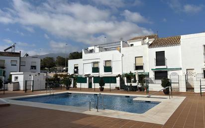 Exterior view of Single-family semi-detached for sale in Benalmádena  with Air Conditioner and Terrace